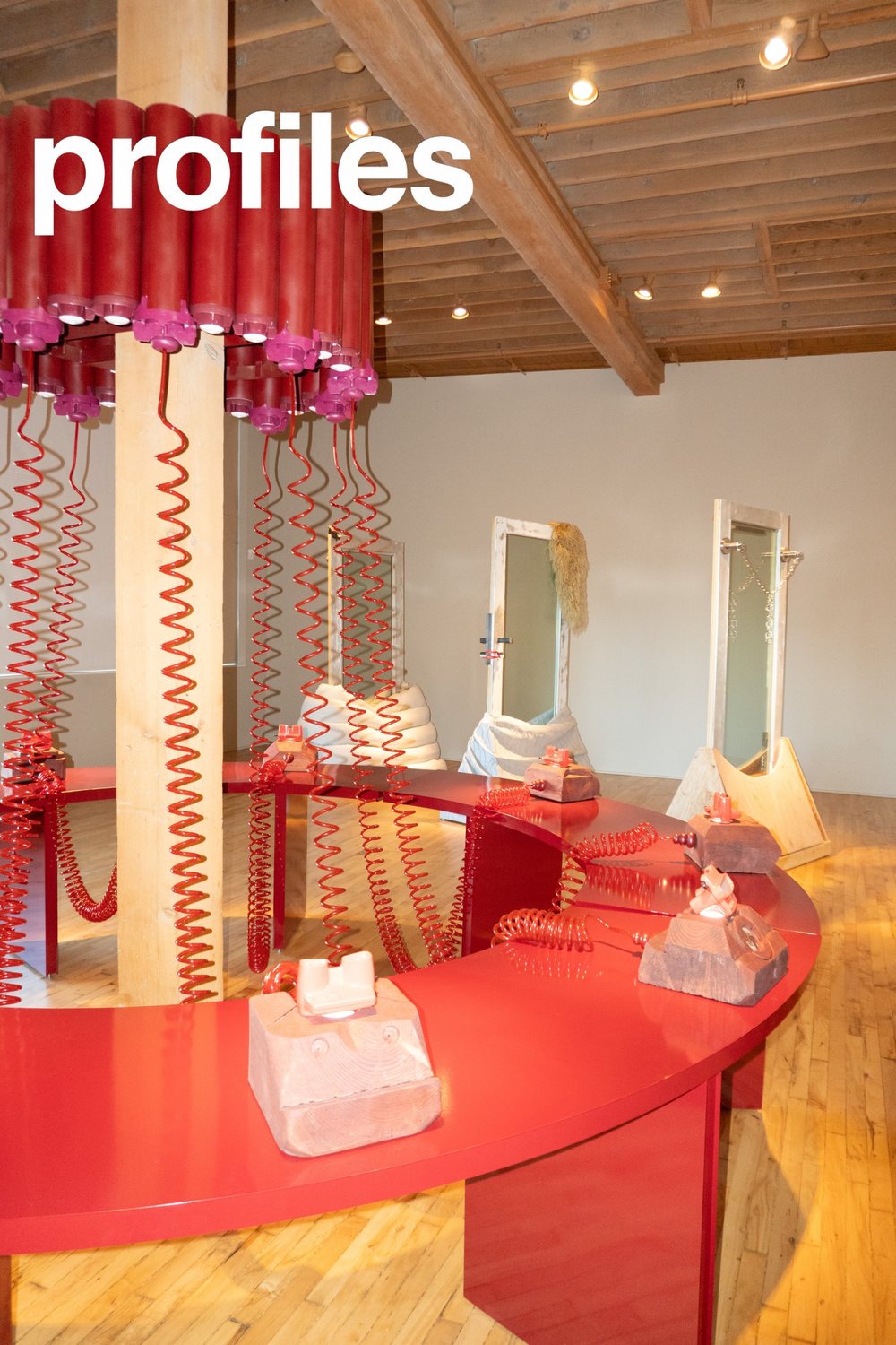 Red coiled-cord installation at the Osmose Design exhibition, Lumber Room PDX